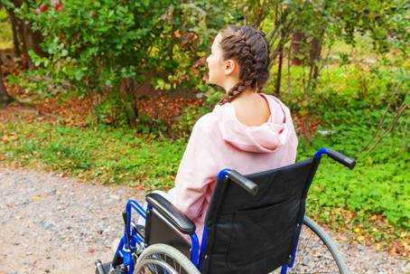 Young woman in a wheelchair.